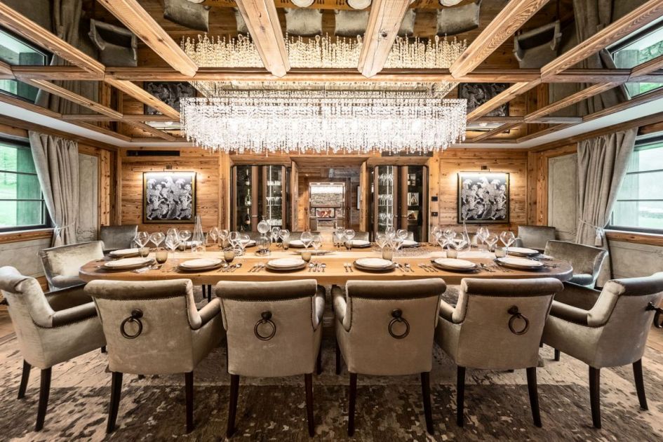 Luxury Christmas ski holiday. Dining table laid up for a festive feast at Chalet Fenice.
