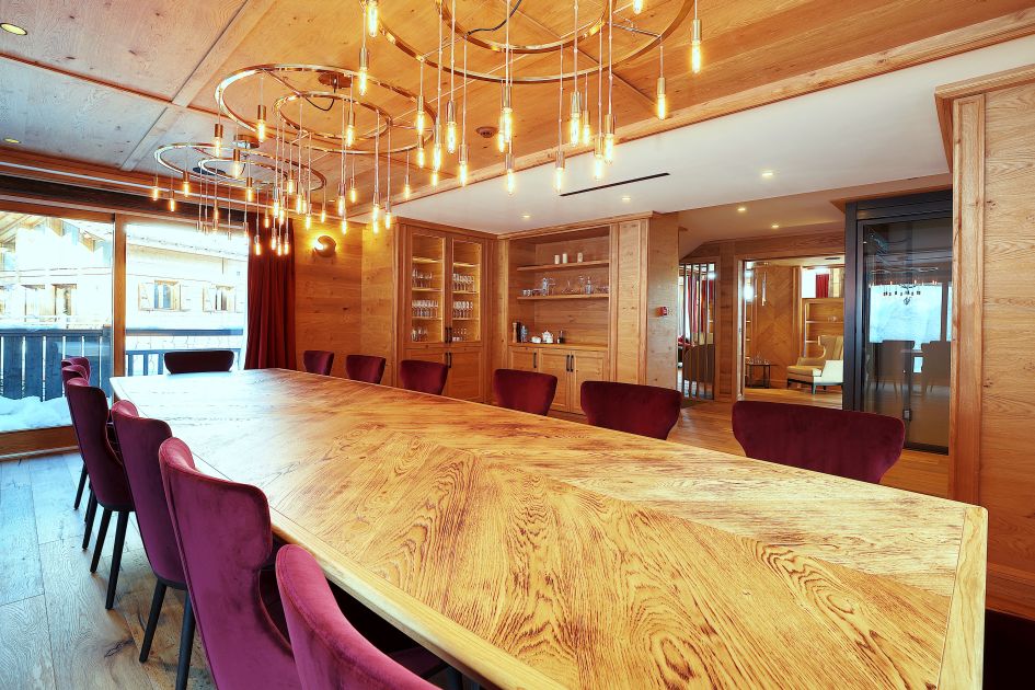 Dining Area Chalet Aurore Luxury Chalets in 1850. Wooden dining table. Super Luxury Dining.