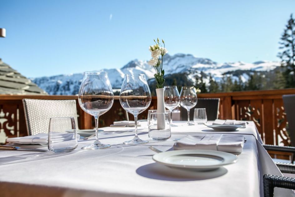 The terrace area of Baumanière 1850, a Michelin Star Restaurant in Courchevel 1850, offers spectacular mountain views in addition to incredible, gourmet food.