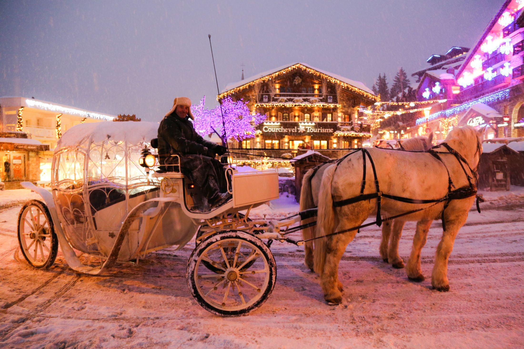 Christmas in Courchevel, showing a horse and kart ride in the snow