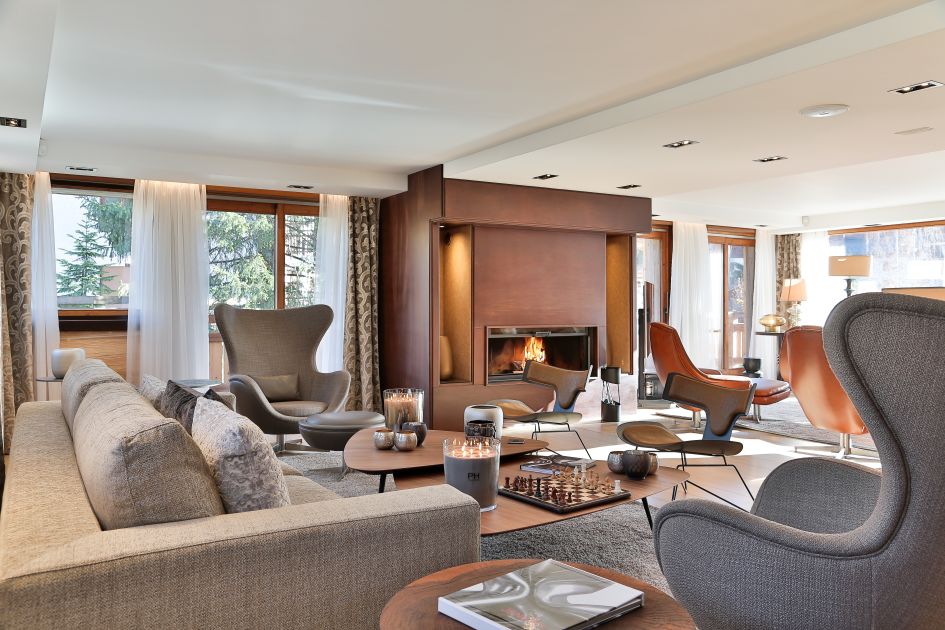 Cosy and homely living room of luxury Chalet Alexandra in Megeve, perfect for relaxing after a day of skiing. 
