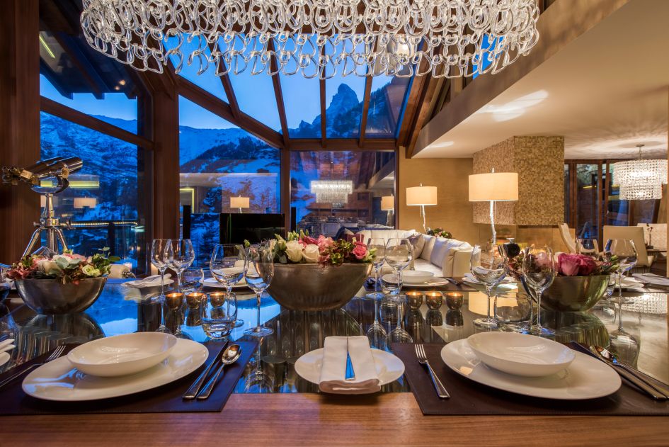 Spectacular gourmet dining at Chalet Zermatt Peak is complete with a Matterhorn view. The roof was designed to allow guests at dinner to look at the mountains. 