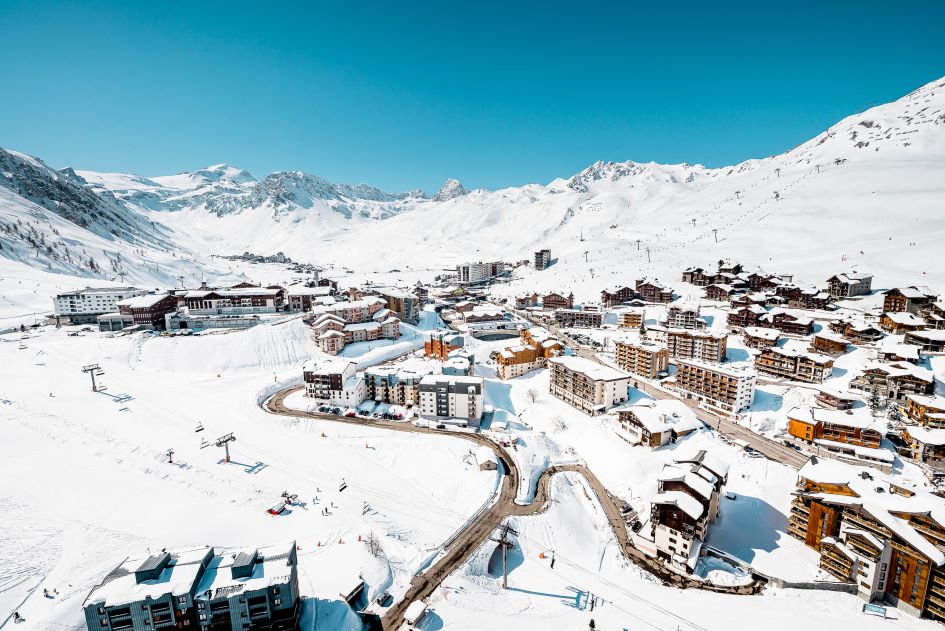 Tignes Le Lac. Credits: Andy Parant. The village of Tignes Le Lac, one of the resorts of Tignes, with the surrounding snowy ski area and mountain panorama in the background.