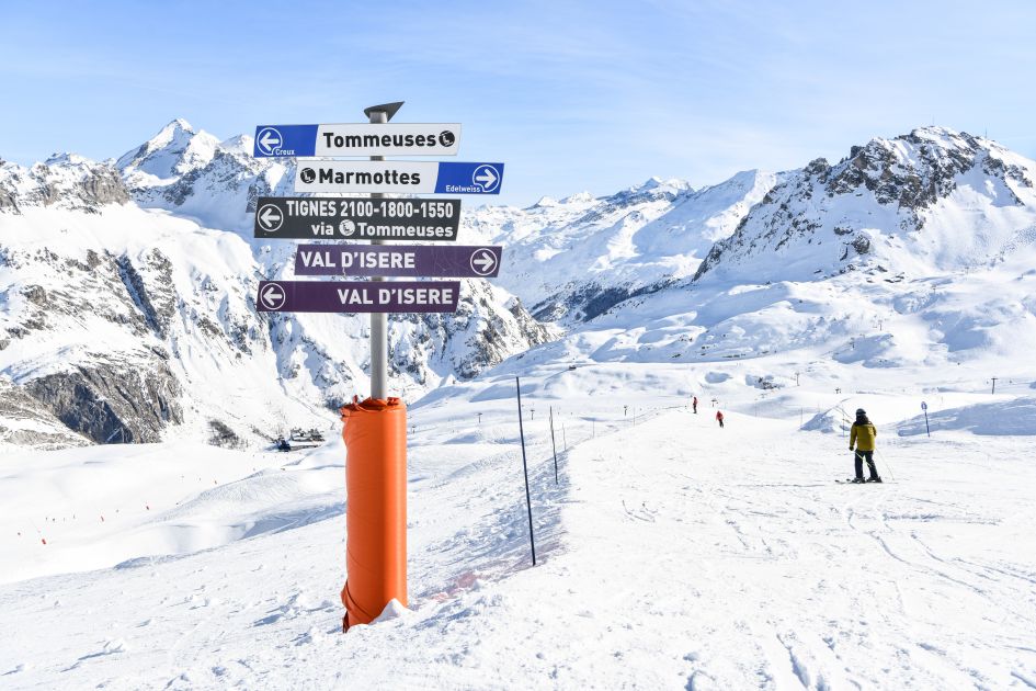 Signposts on the ski slopes pointing towards Tignes and Val d'Isère, two ski resorts with the longest seasons in the Alps. 