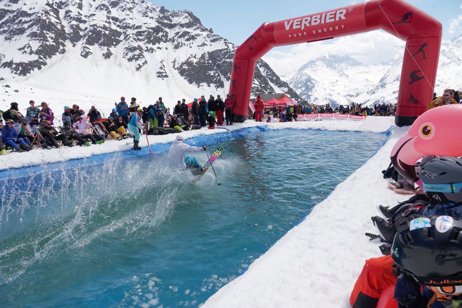 A skier attempting a pond skim in Verbier at the Ultime Session, the resort's closing party that culminates one of the longest ski seasons in the Alps.